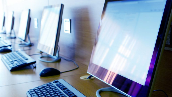 Row of flat panel computer monitors