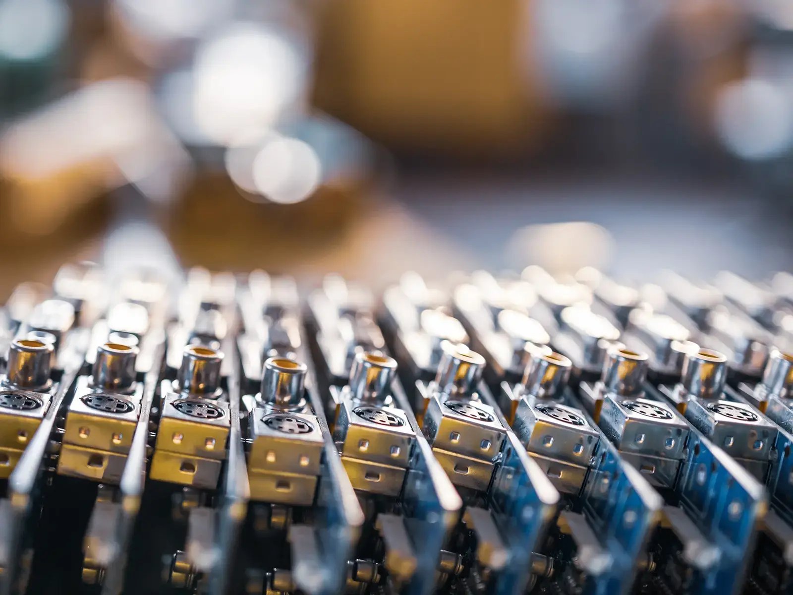 Electrical controls lined up in rows, each with metallic finishes and intricate details.