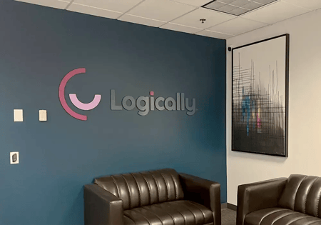 Office waiting area with dark blue walls, featuring 