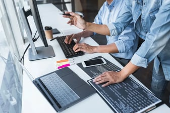 A programmer typing code at work