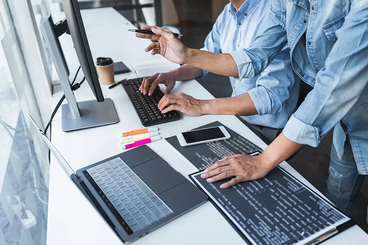 A programmer typing code at work