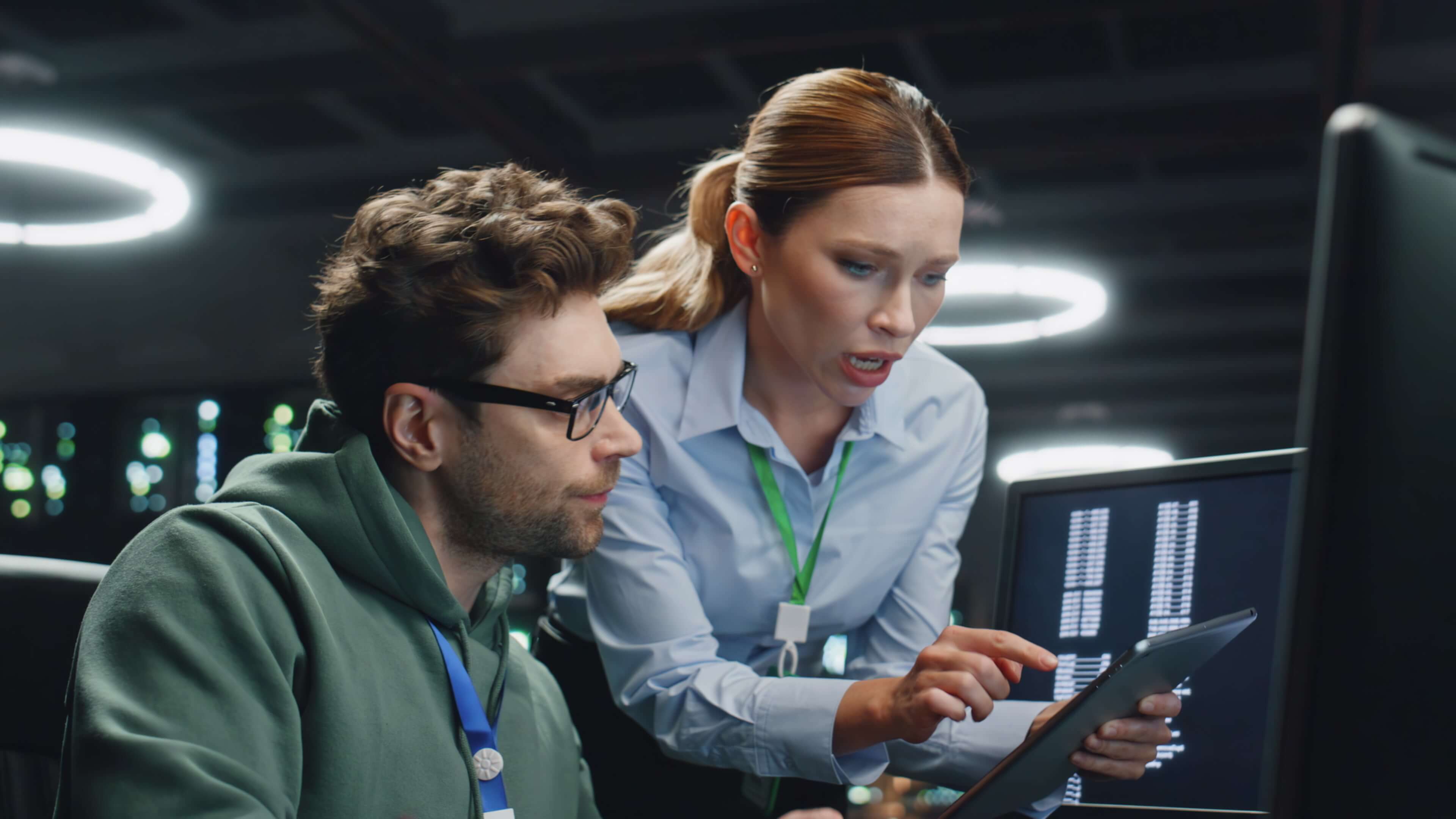 Man and woman looking at tablet screen