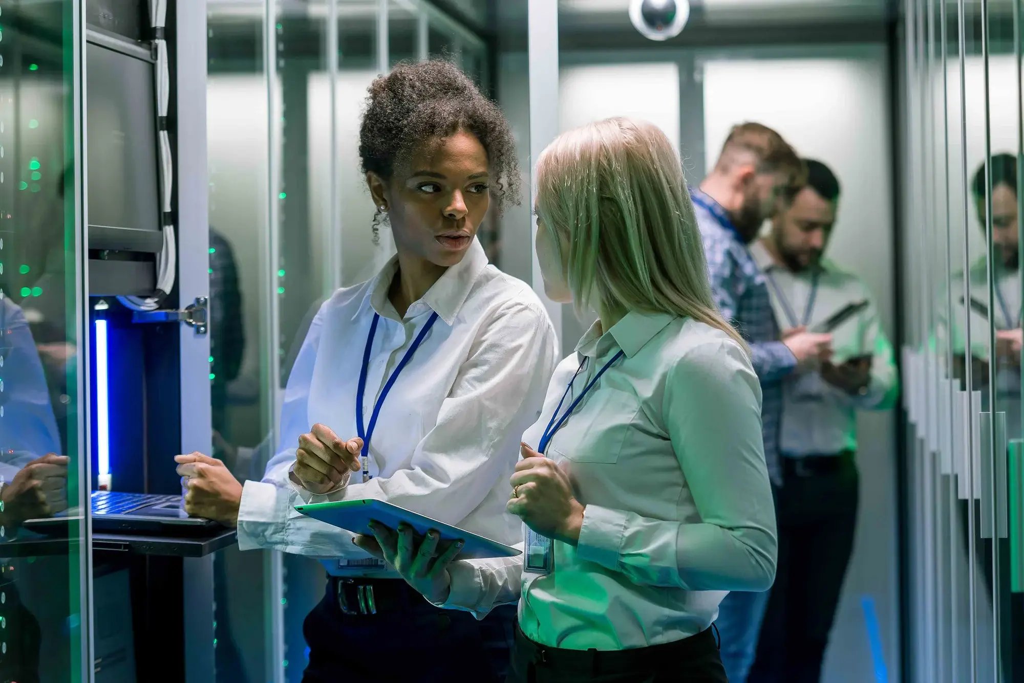 Two women talking in server room